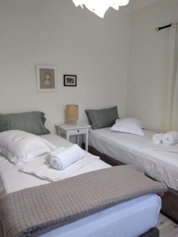 Łóżko lub łóżka w pokoju w obiekcie VILLA ANDRIANA