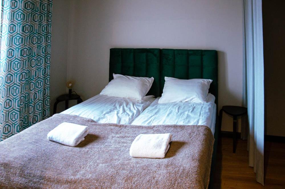 Postel nebo postele na pokoji v ubytování Topaz Apartamenty