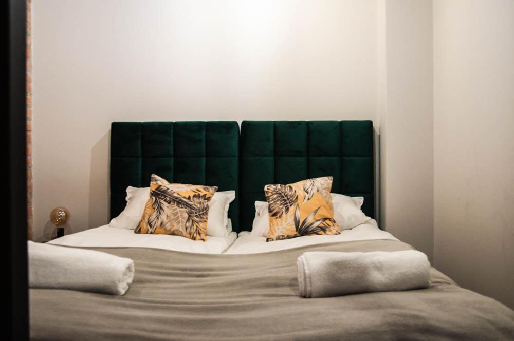 Postel nebo postele na pokoji v ubytování Topaz Apartamenty