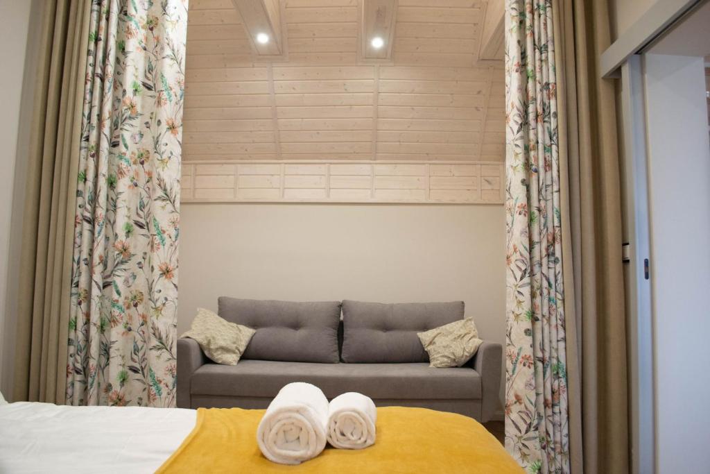 Postel nebo postele na pokoji v ubytování Topaz Apartamenty