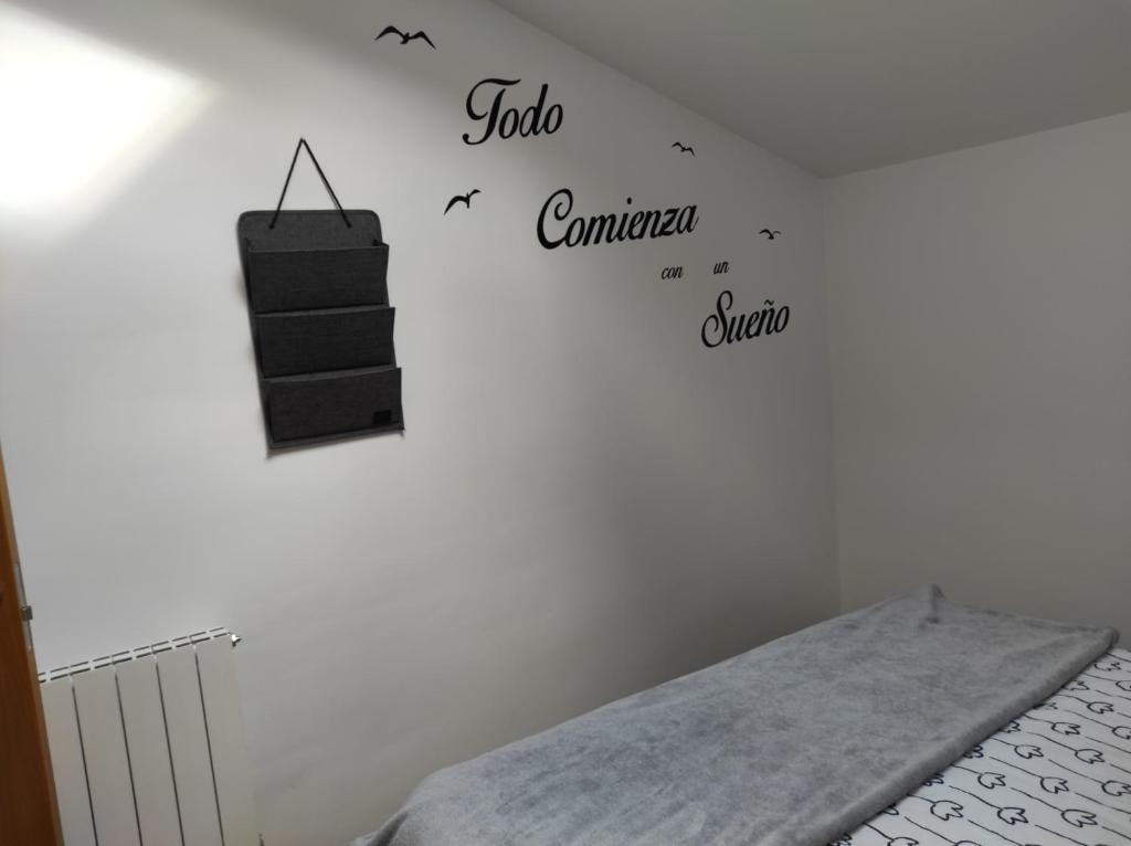 A bed or beds in a room at El Tesoro de Baco