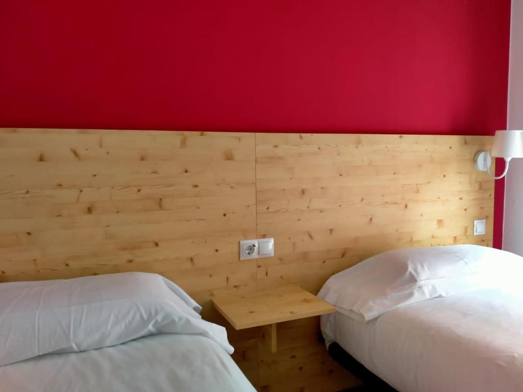 Postel nebo postele na pokoji v ubytování Hostal Meson de Paco