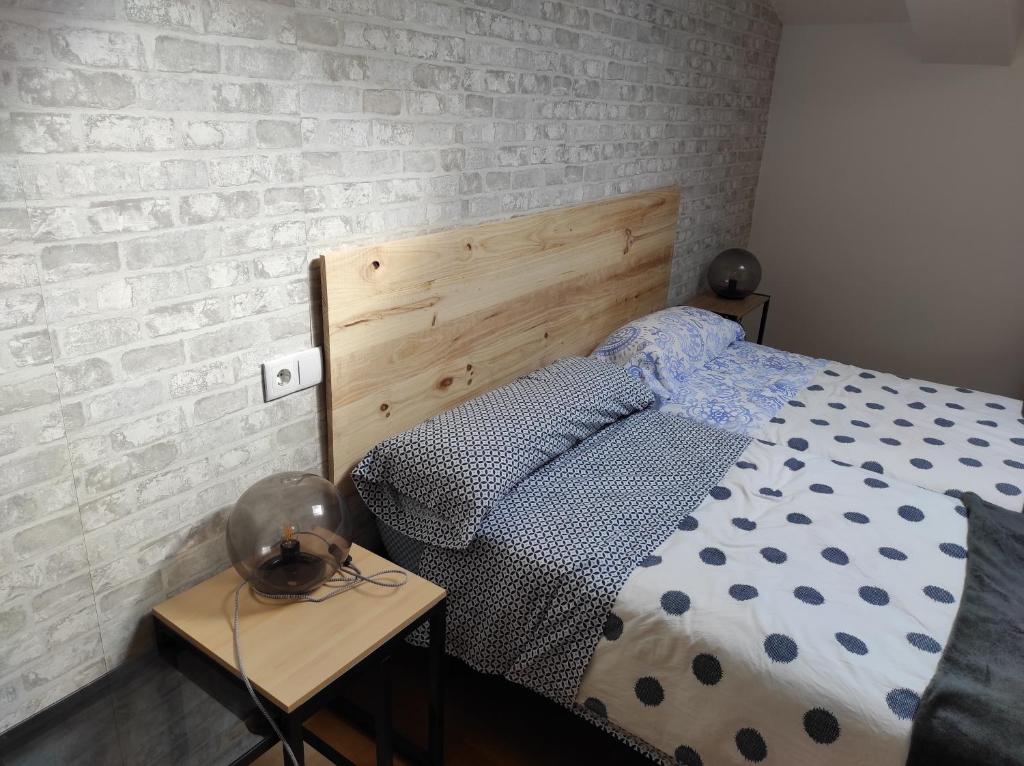 A bed or beds in a room at El Tesoro de Baco