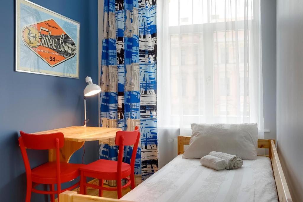 Postel nebo postele na pokoji v ubytování Orange Cat Rooms