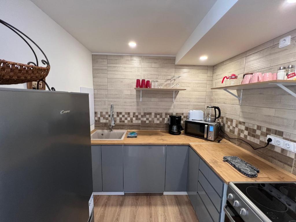 Kuchyň nebo kuchyňský kout v ubytování Apartments Badallee 4
