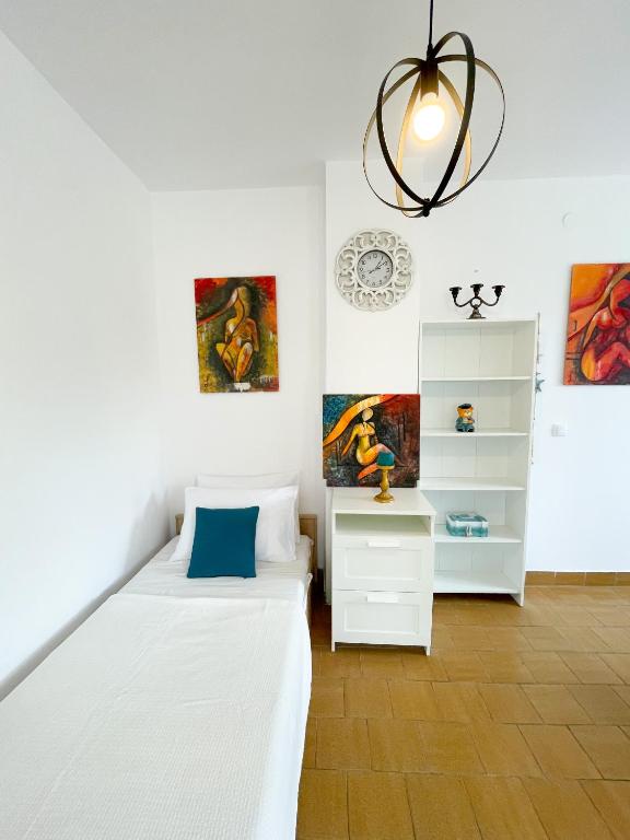 Posteľ alebo postele v izbe v ubytovaní Spacious Apartment Amaros