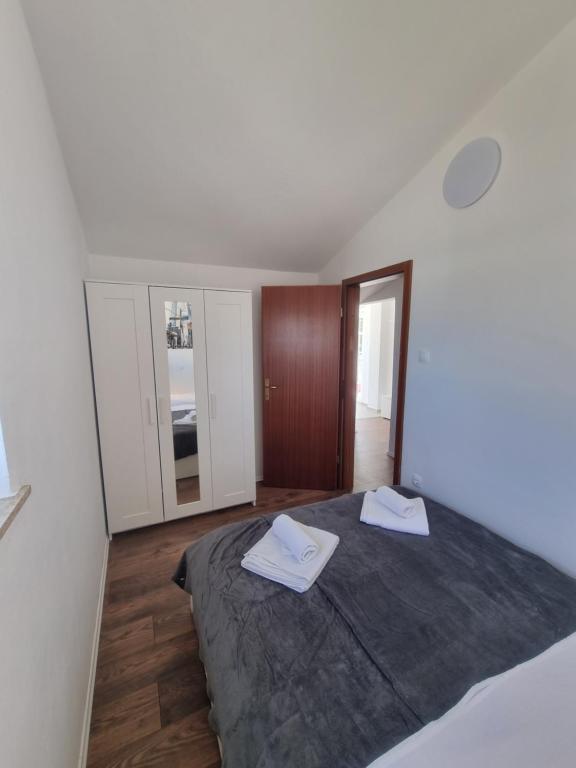 Postel nebo postele na pokoji v ubytování Apartment Miric