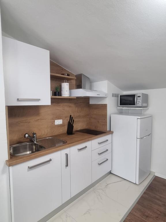 Kuchyň nebo kuchyňský kout v ubytování Apartment Miric