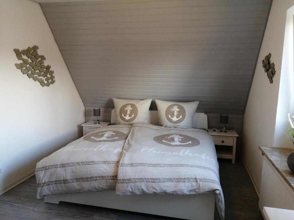 Ένα ή περισσότερα κρεβάτια σε δωμάτιο στο Bude im Windrosenweg