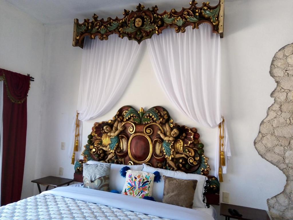 Postel nebo postele na pokoji v ubytování Hotel Villa Peñasco