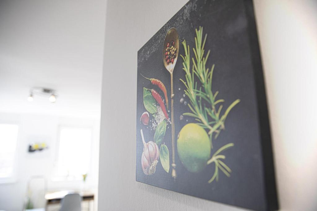 a painting of fruits and vegetables on a wall at Apartman Tara in Varaždin