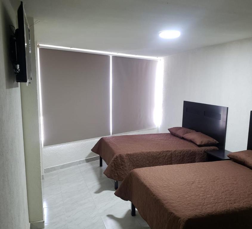 TV a/nebo společenská místnost v ubytování Hotel Estadía