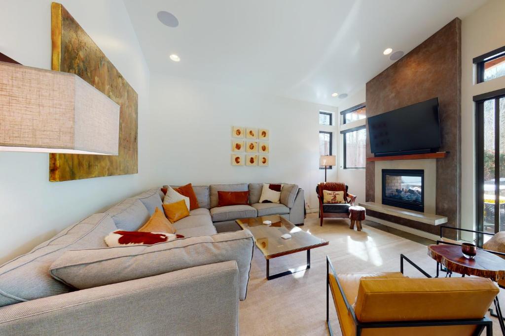a living room with a couch and a fireplace at Belmont Beauty in Ketchum