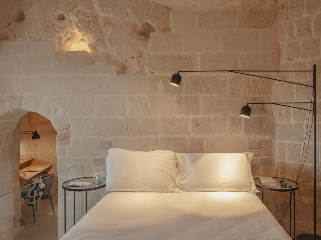 Postel nebo postele na pokoji v ubytování Palazzo Degli Abati