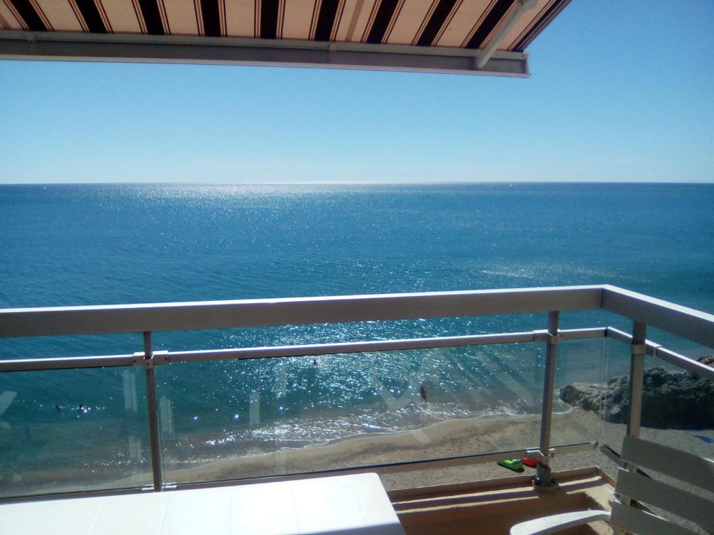 a view of the ocean from a balcony at Studio Cabine Sète Corniche Vue Mer in Sète
