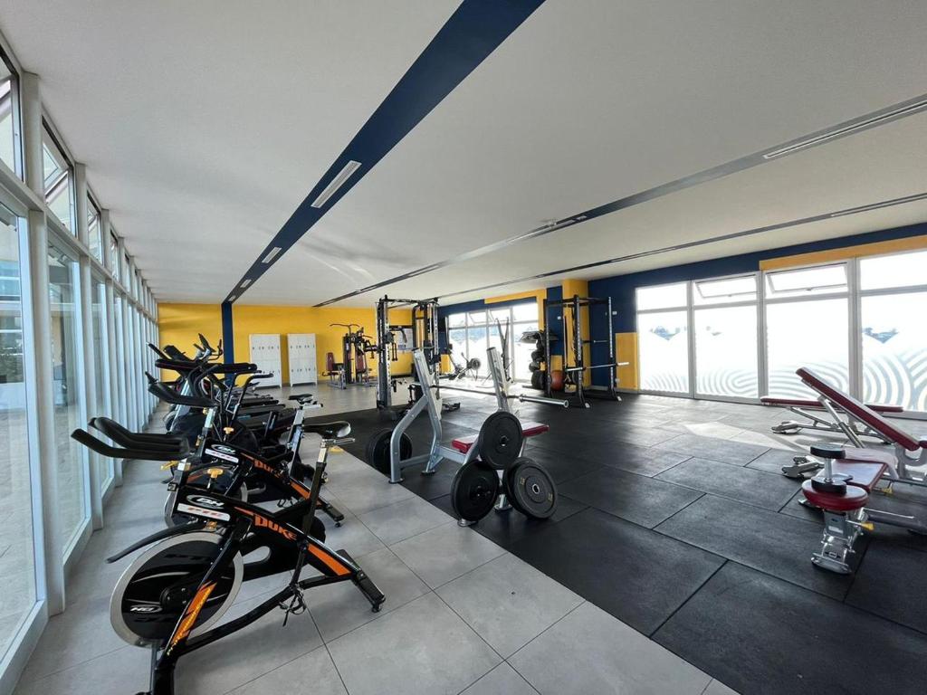 a gym with a bunch of bikes in a room at Bambu-Rivera Club Residences in San José