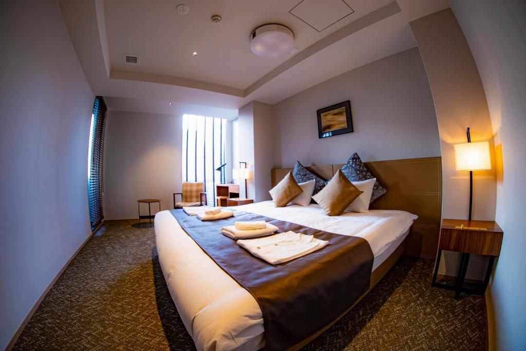 Postel nebo postele na pokoji v ubytování Hotel S-Presso South