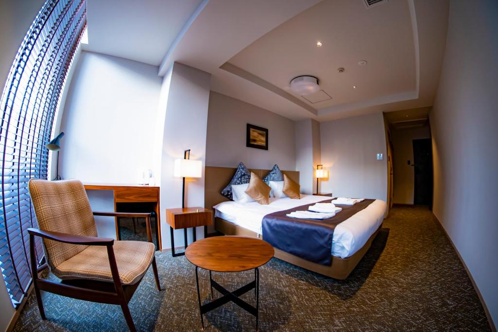 Postel nebo postele na pokoji v ubytování Hotel S-Presso South