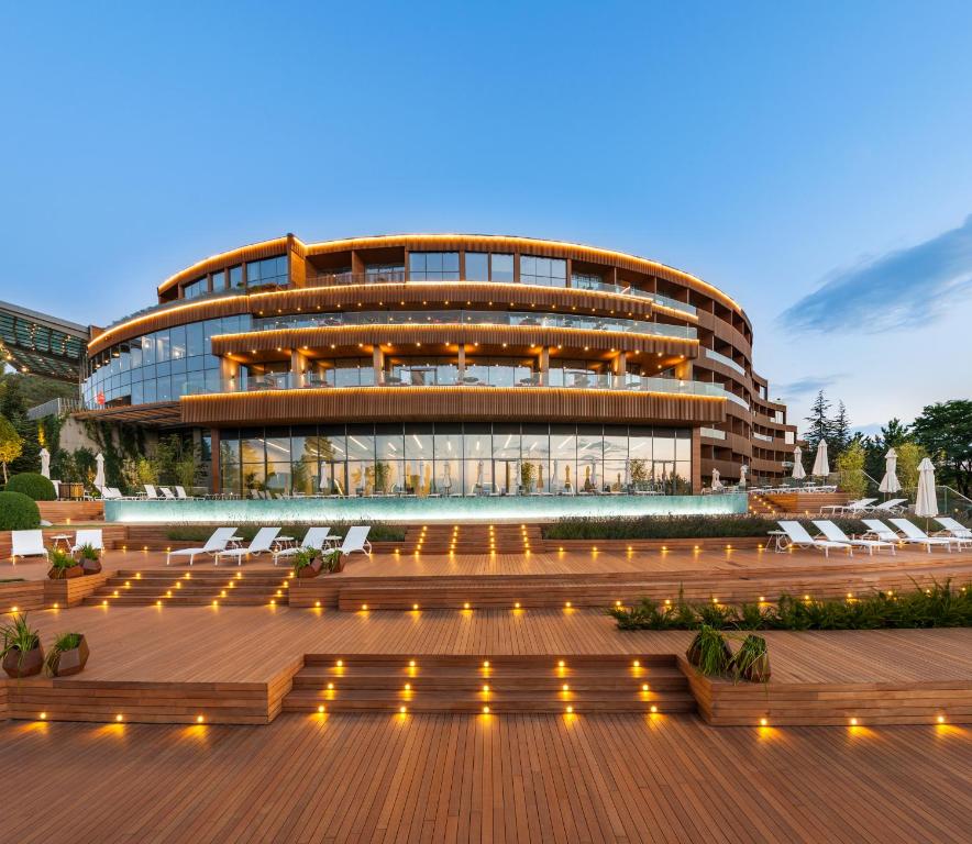 a building with a deck and a building with lights at Tasigo Eskisehir in Eskisehir