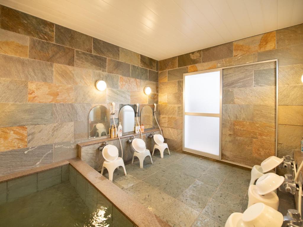 Koupelna v ubytování Tabist Hamatoya Ryokan Mens Only