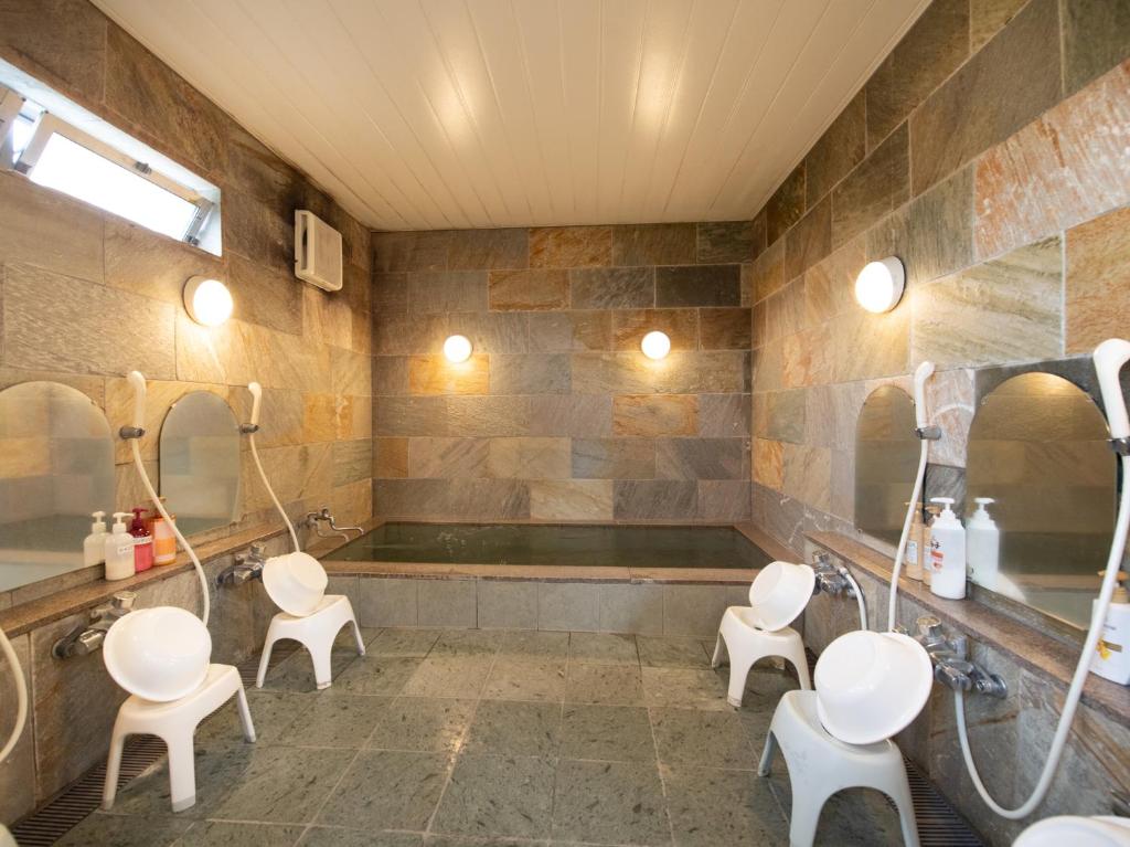 Koupelna v ubytování Tabist Hamatoya Ryokan Mens Only