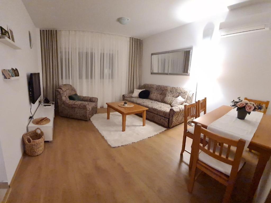 a living room with a couch and a table at Apartman Lucija Međugorje in Međugorje