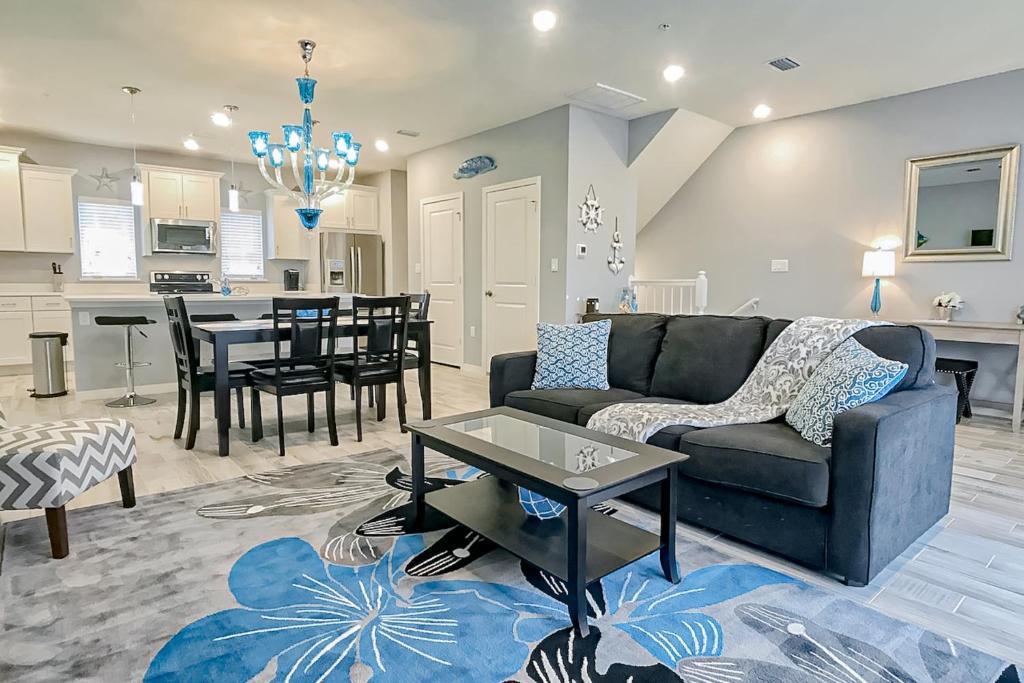 a living room with a couch and a table at Azure Dream in Perdido Key