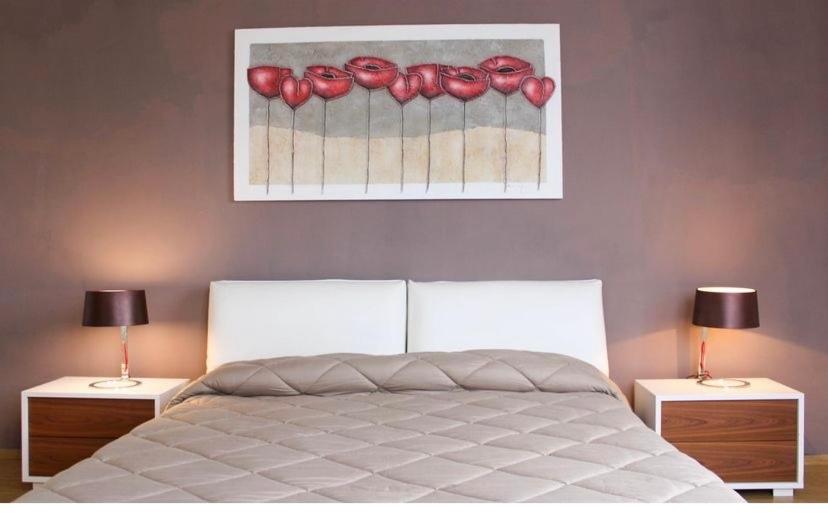 A bed or beds in a room at Porto Gaio Accomodation