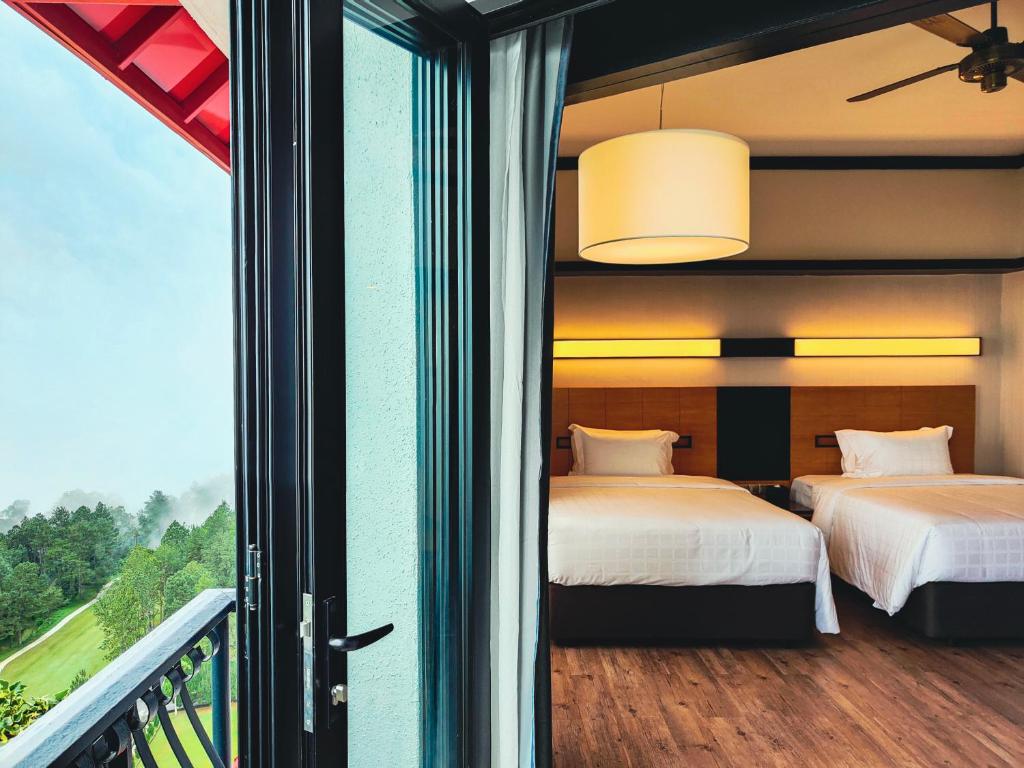 Postel nebo postele na pokoji v ubytování Resorts World Awana