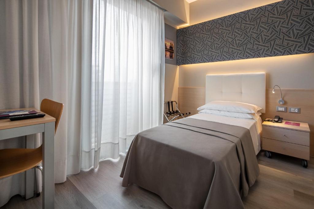 Postel nebo postele na pokoji v ubytování Hotel Rosanna 3 Stelle Superior