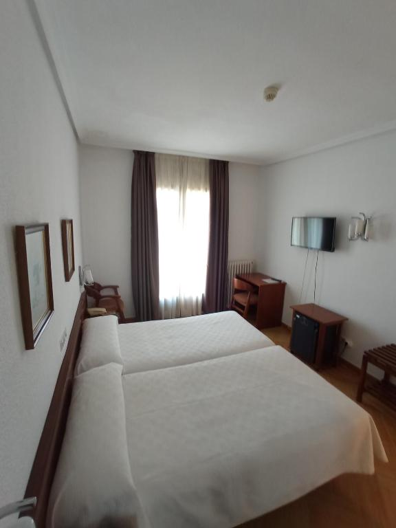Postel nebo postele na pokoji v ubytování Hotel ELE Acueducto