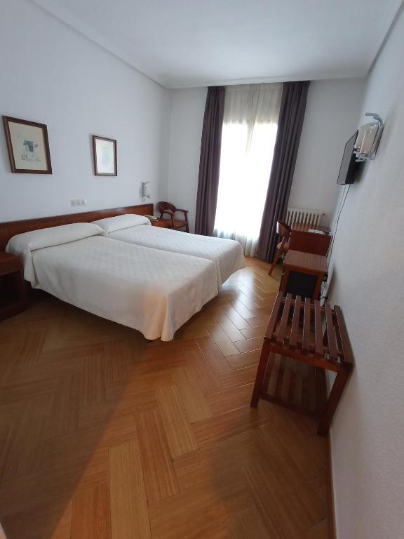 Postel nebo postele na pokoji v ubytování Hotel ELE Acueducto