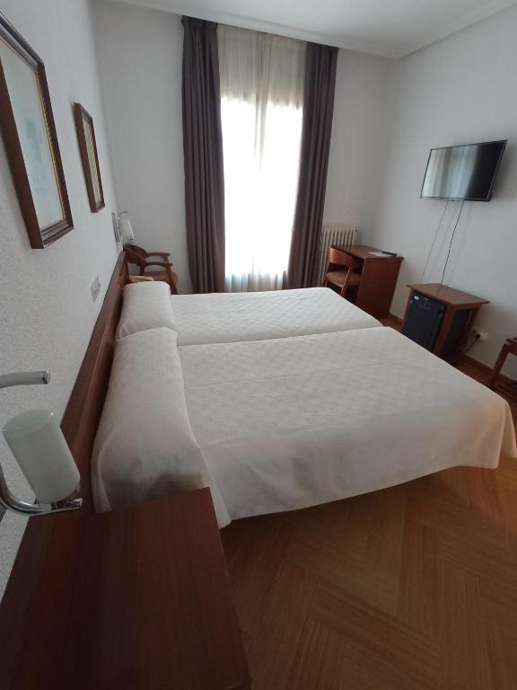 Postel nebo postele na pokoji v ubytování Hotel ELE Acueducto