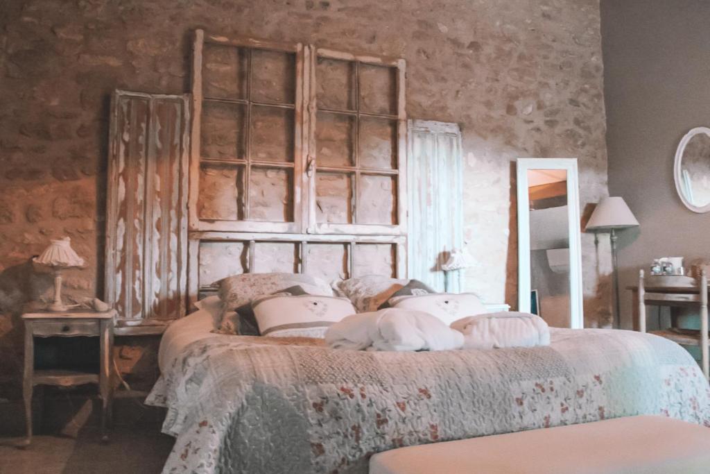 Postel nebo postele na pokoji v ubytování La Bastide des Songes - Demeure d'hôtes