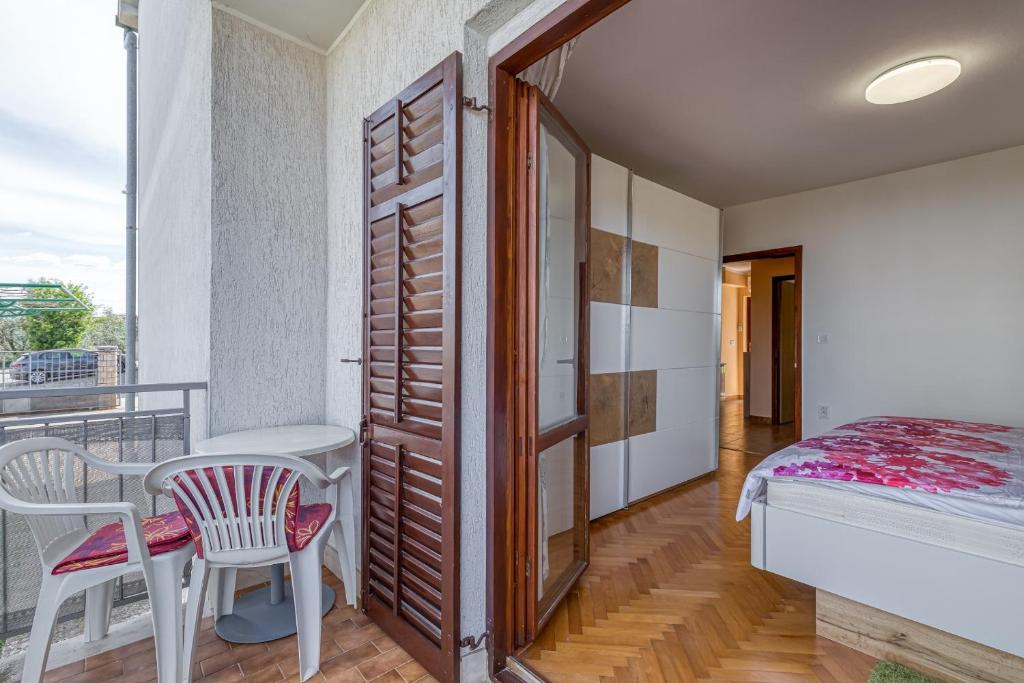 Postel nebo postele na pokoji v ubytování Apartment Mirijana