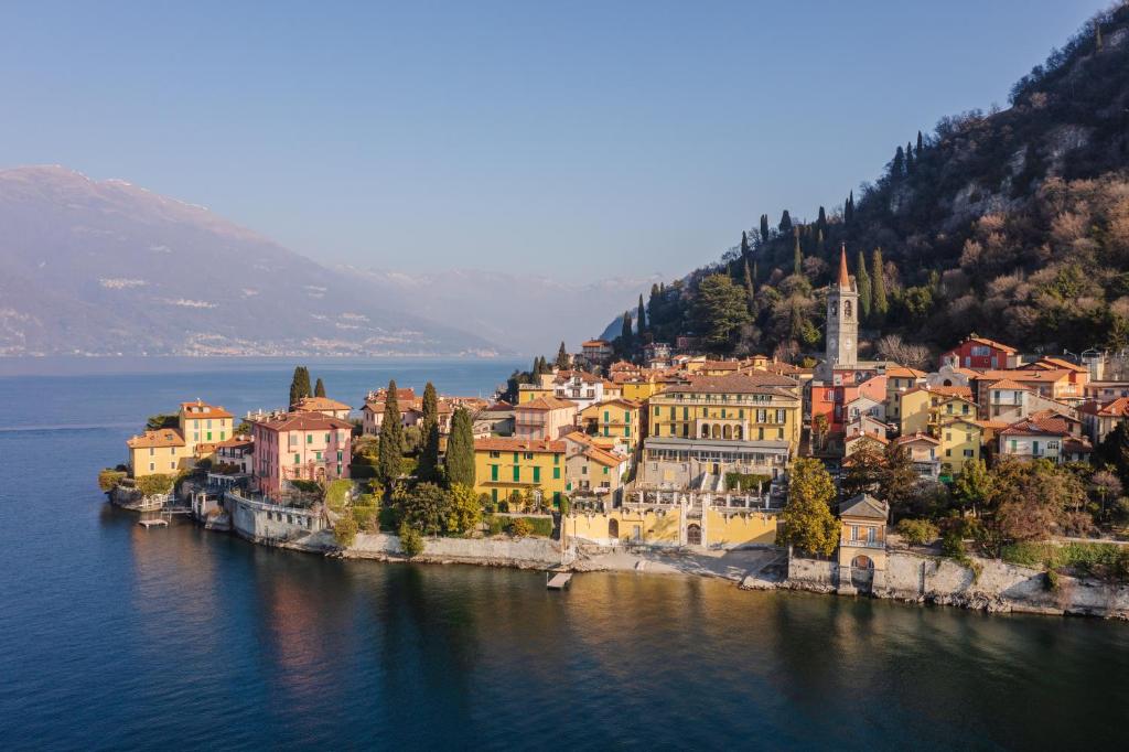 
a scenic view of a city with a large body of water at Hotel Royal Victoria, by R Collection Hotels in Varenna
