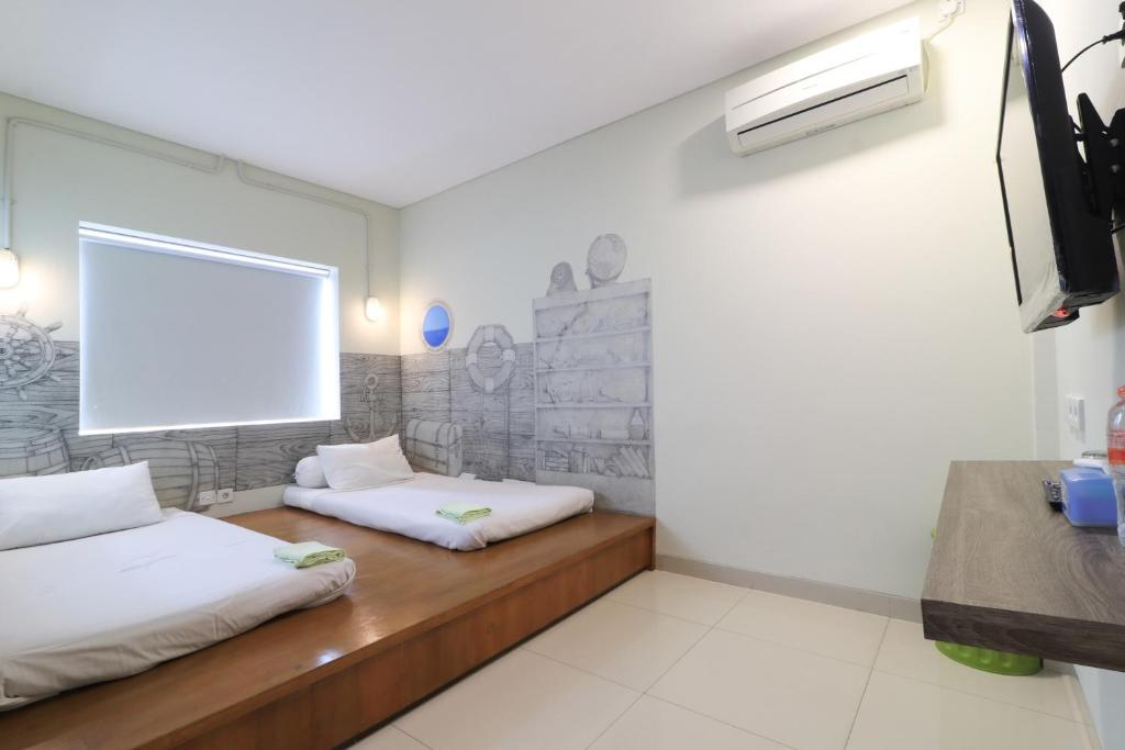 TV a/nebo společenská místnost v ubytování Locus Rooms