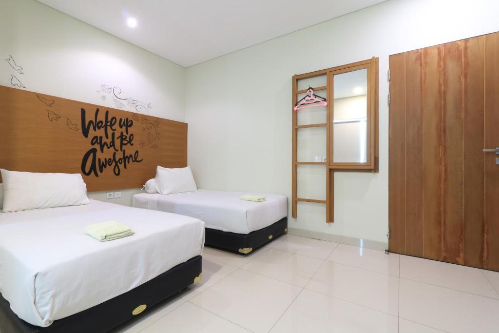 Postel nebo postele na pokoji v ubytování Locus Rooms
