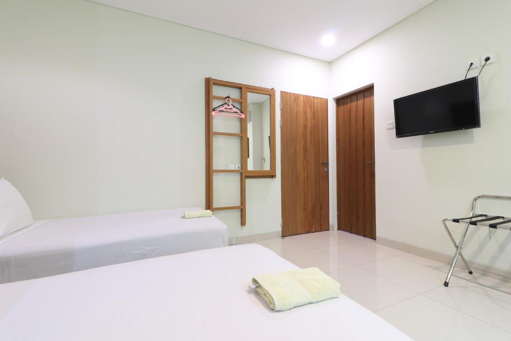 TV a/nebo společenská místnost v ubytování Locus Rooms