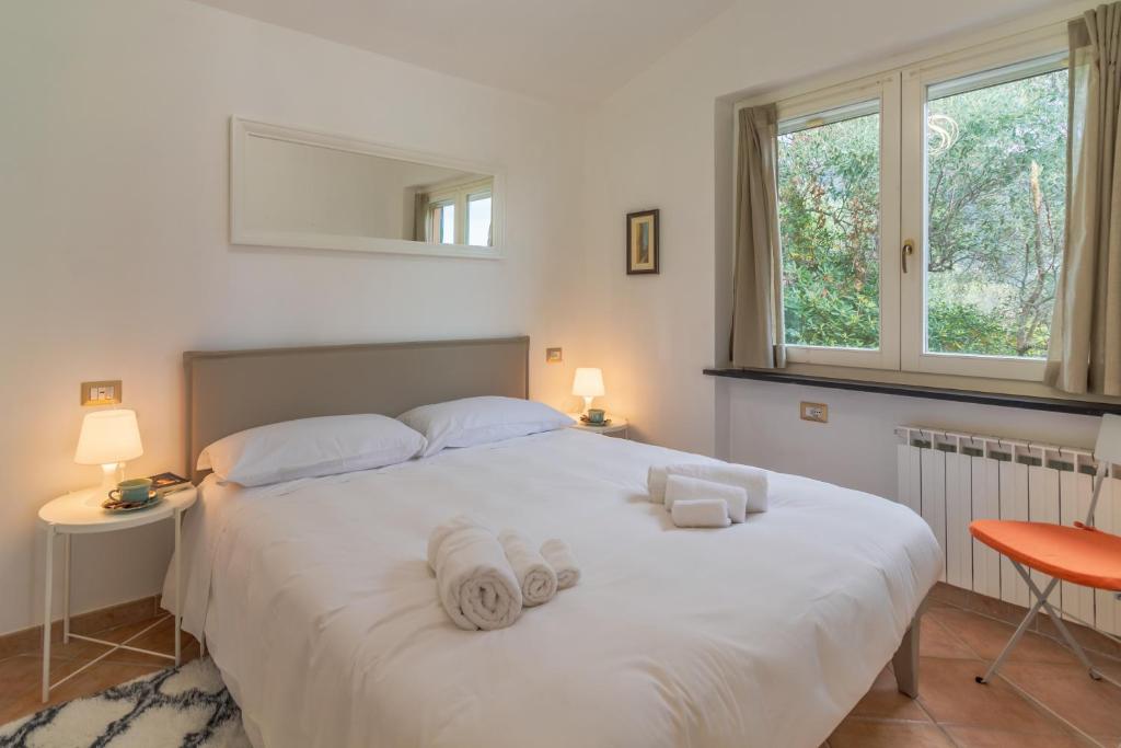 Postel nebo postele na pokoji v ubytování CASA CAMILLA Relax con una vista da sogno