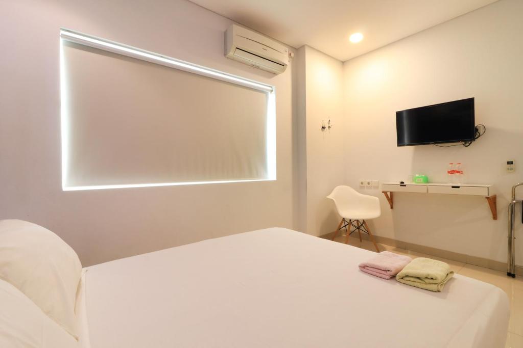 TV a/nebo společenská místnost v ubytování Locus Rooms