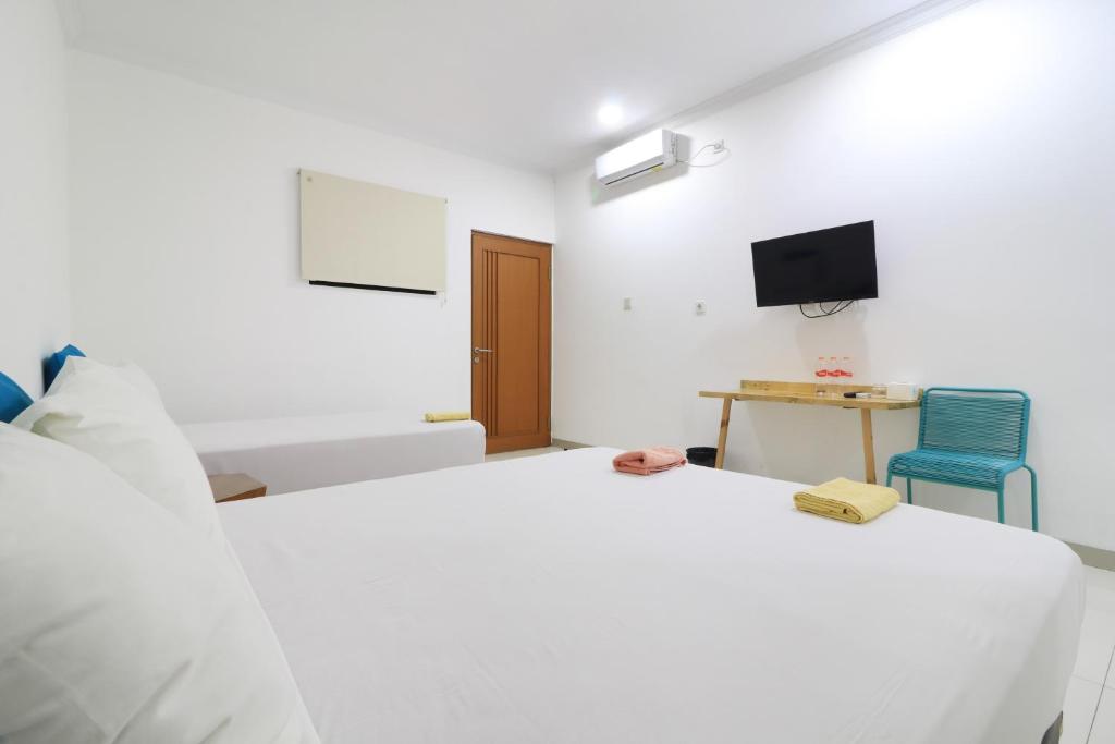 Postel nebo postele na pokoji v ubytování Locus Rooms