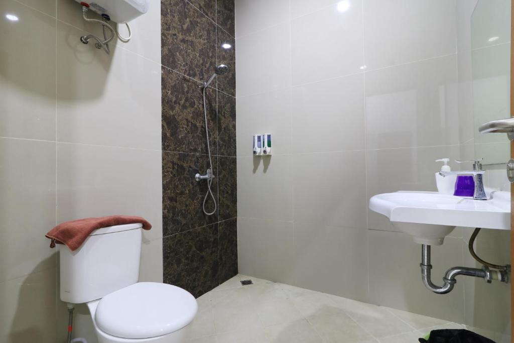 Koupelna v ubytování Locus Rooms