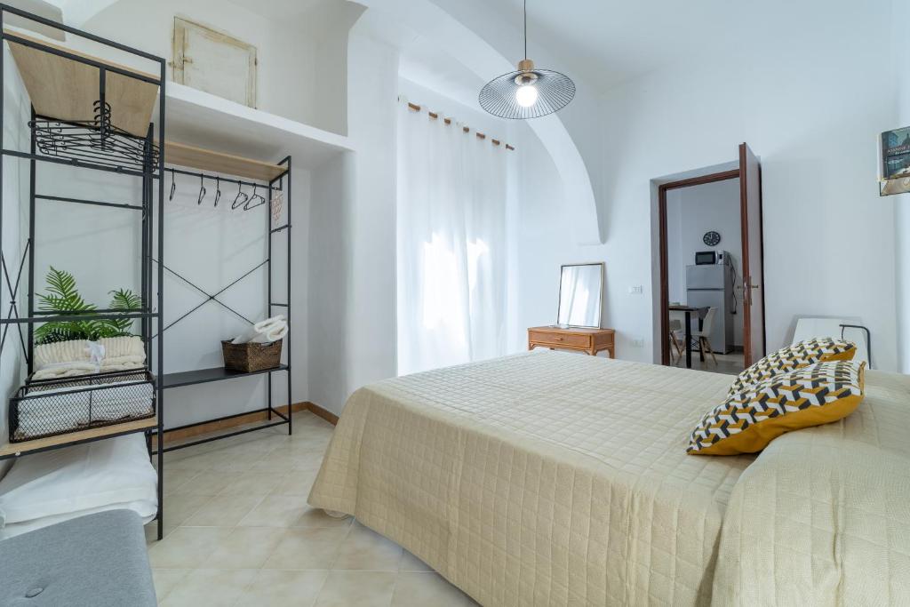 Łóżko lub łóżka w pokoju w obiekcie La Casa Di Maya