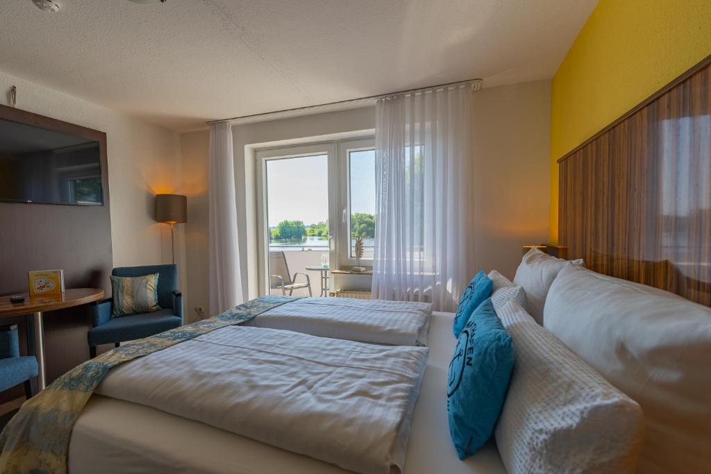 Postel nebo postele na pokoji v ubytování Hotel Nordstern