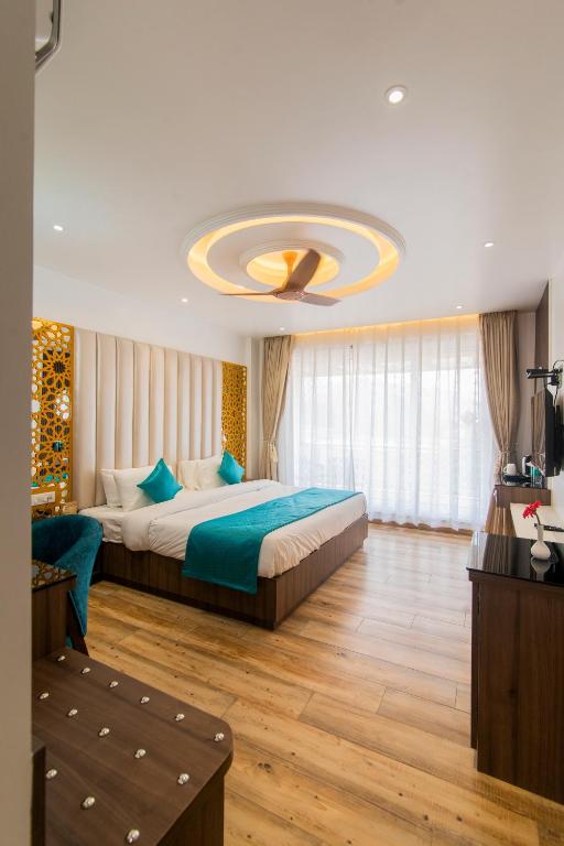 Postel nebo postele na pokoji v ubytování Hotel Yog Vashishth
