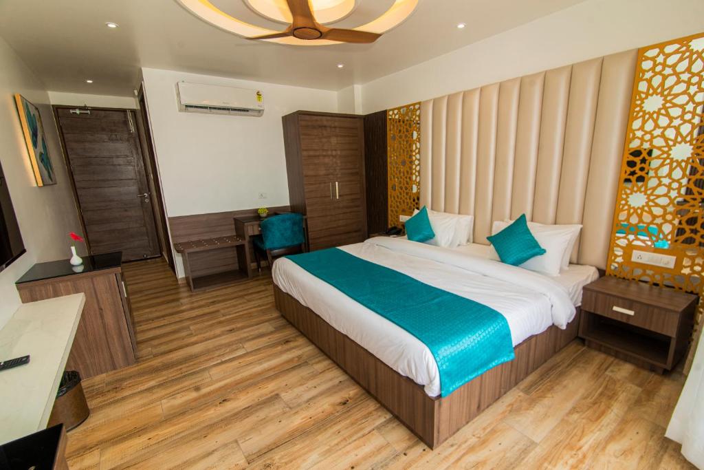 Postel nebo postele na pokoji v ubytování Hotel Yog Vashishth