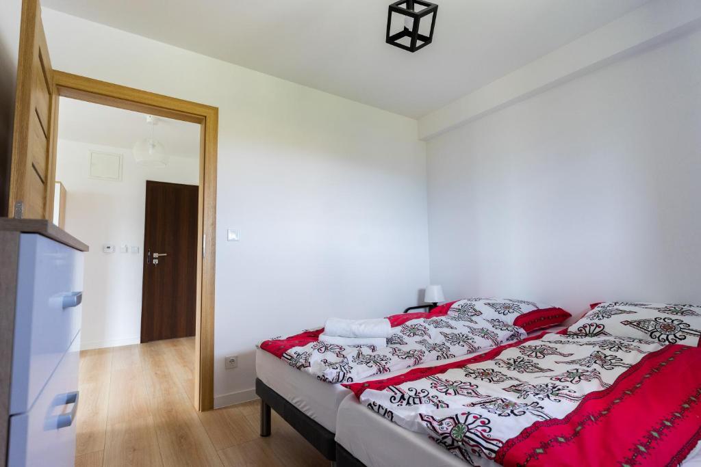 Posteľ alebo postele v izbe v ubytovaní Krościenko Grywałd Czorsztyn Apartamenty Frysiówka