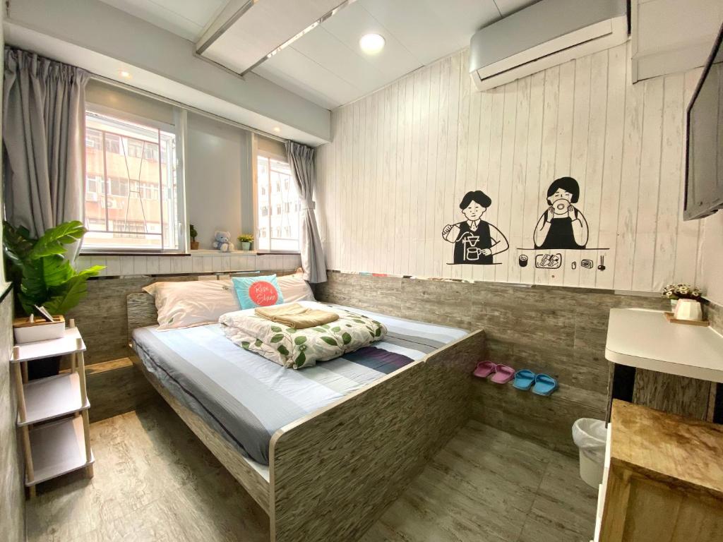Posteľ alebo postele v izbe v ubytovaní Hong Kong Hostel (Tsim Sha Tsui Mansion)