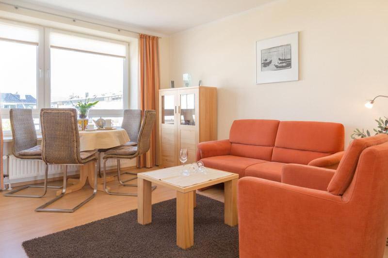 a living room with a couch and a table at F23 App 25 Kurt S Island in Westerland (Sylt)